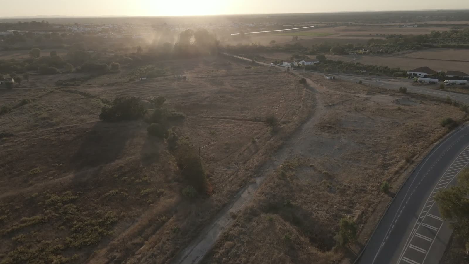 Aerial view of dry paddocks at first light
