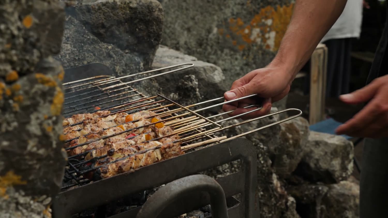 Skewers over an open charcoal grill